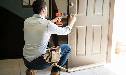 Man installing door lock